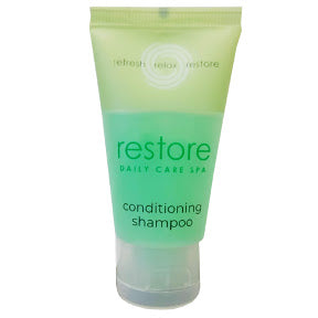Dial® Restore Daily Care Spa Conditioning Shampoo C03-0114001-8100-1 fl. oz. travel size bottle of conditioning shampoo.