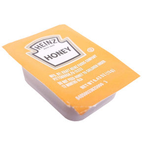 Heinz Grade A Honey Cup F01-0500101-2100 - 12 g. cup of U.S. Grade A light amber honey.